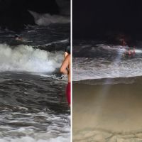 Dupla fica presa pelas ondas na pedra do Trampolim em Cabeçudas