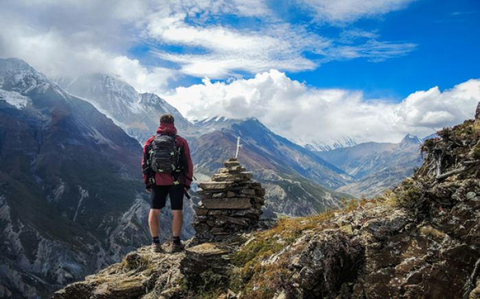 https://unsplash.com/photos/man-standing-on-top-of-mountain-beside-cairn-stones-48nerZQCHgo